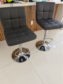 2  leather stools - like new