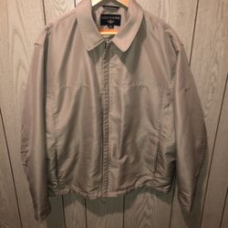 Men’s size XL tan Docker’s stain defender coat with inside pockets and one is for your cell phone. Genius! Lol. It has a super great feel to it and w
