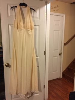 Long formal gown, eggshell color, perfect for wedding, halter sheer top, ruffles down the back, look beautiful on... size xl