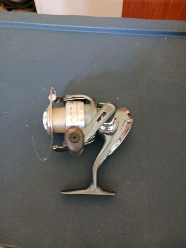 A Fishing Reel Silver And Grey