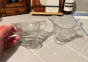 Sugar and creamer set from Cambridge Glass Co with “rose point” design