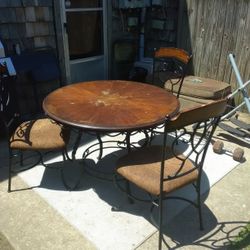 Color Brown Table And Black Chairs 