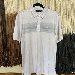 White Travis Mathew polo with teal, navy blue and grey stripes and a Kings River Golf and Country Club logo embroidered on the left arm