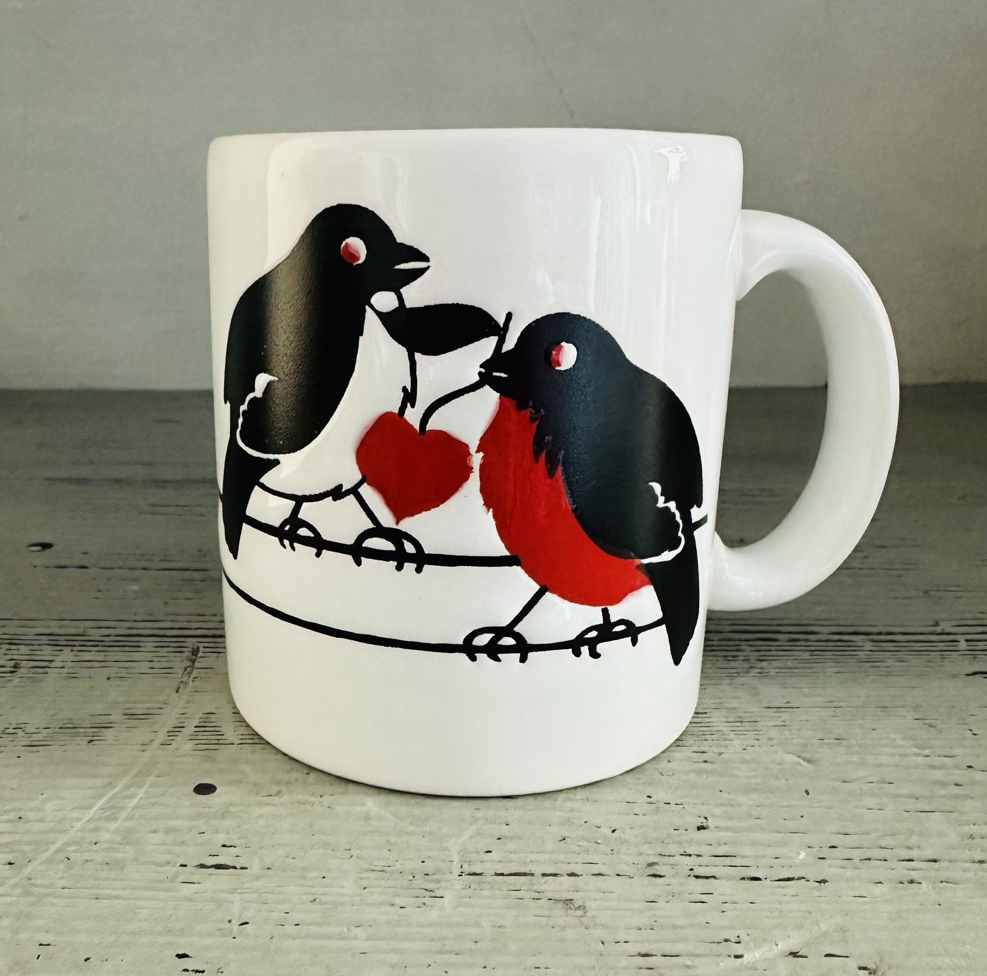  Vintage Waechtersbach West Germany Ceramic Mug  White background with black birds and red heart detail.  Pattern goes all the way around the mug. 