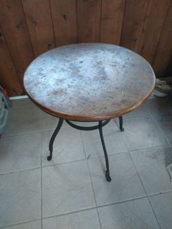 Circular end table used in Warrenville