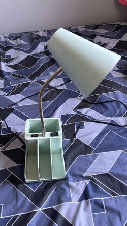 Desk lamp with outlets