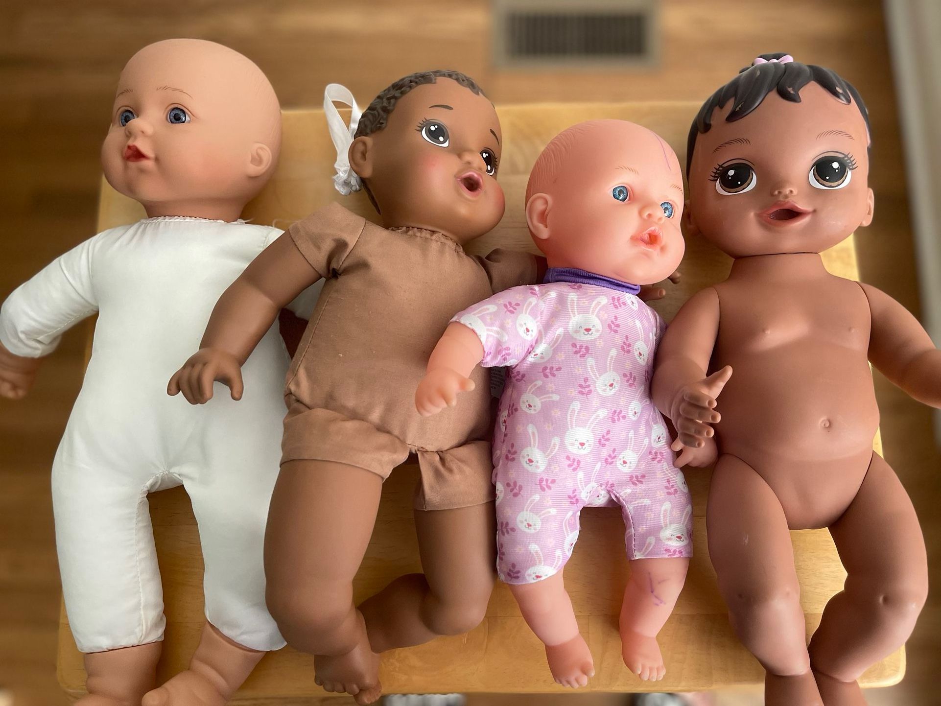 Dolls set of 4, One Doll is Interactive: sneezes, etc.