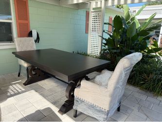 Like New Dining Table with Two Leaves Seats Up to Twelve with Two hostesses chairs included