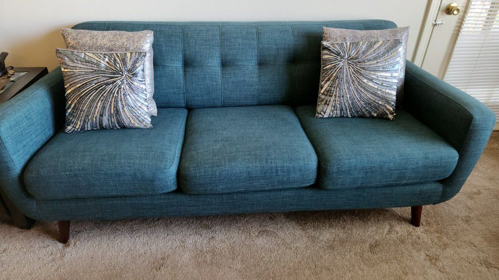 Teal Couch For Three With Cushions