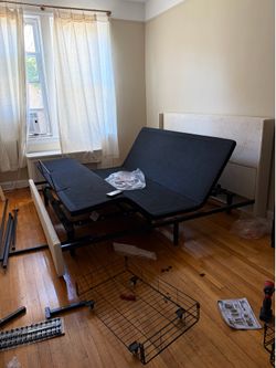 KING BED ADJUSTABLE BASE - PLUGS IN, COMES WITH REMOTE, EXCELLENT CONDITION.