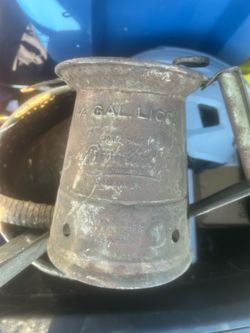 vintage Brookins 1/4 gallon metal oil dispenser, likely used in early service stations.
