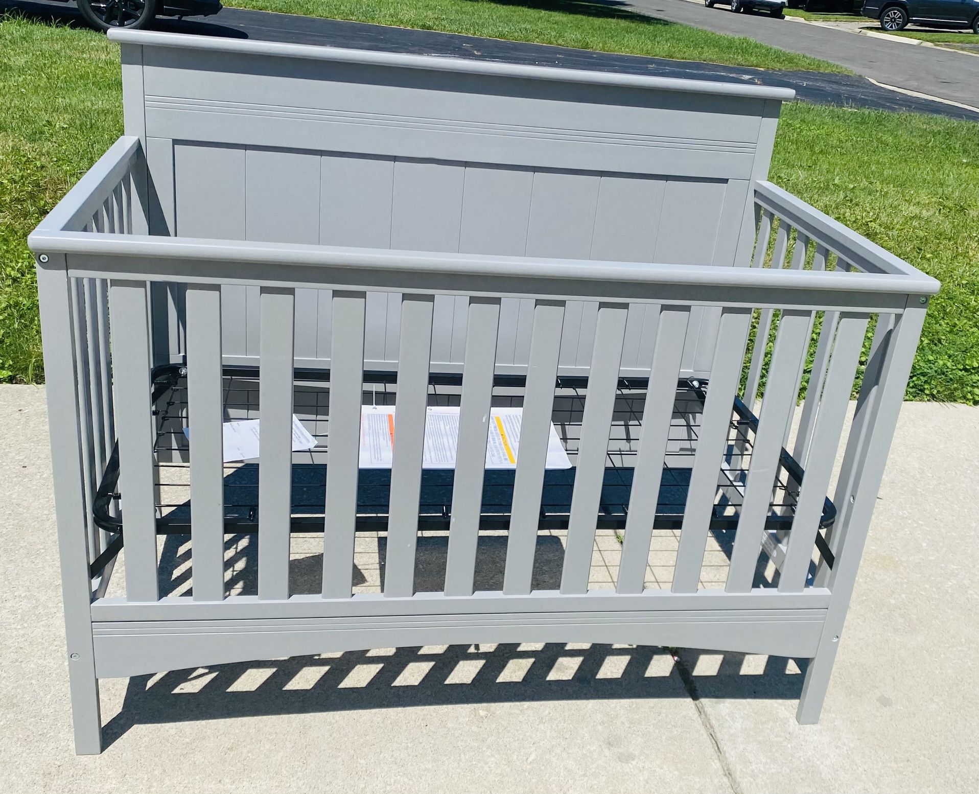 Delta Children Fancy 4-in-1 Convertible Crib in gray. This crib was brand new in the box, never used. I assembled it for the photos. 