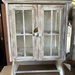 Antique solid wood bathroom cabinet, measures 29" high x 23" wide.