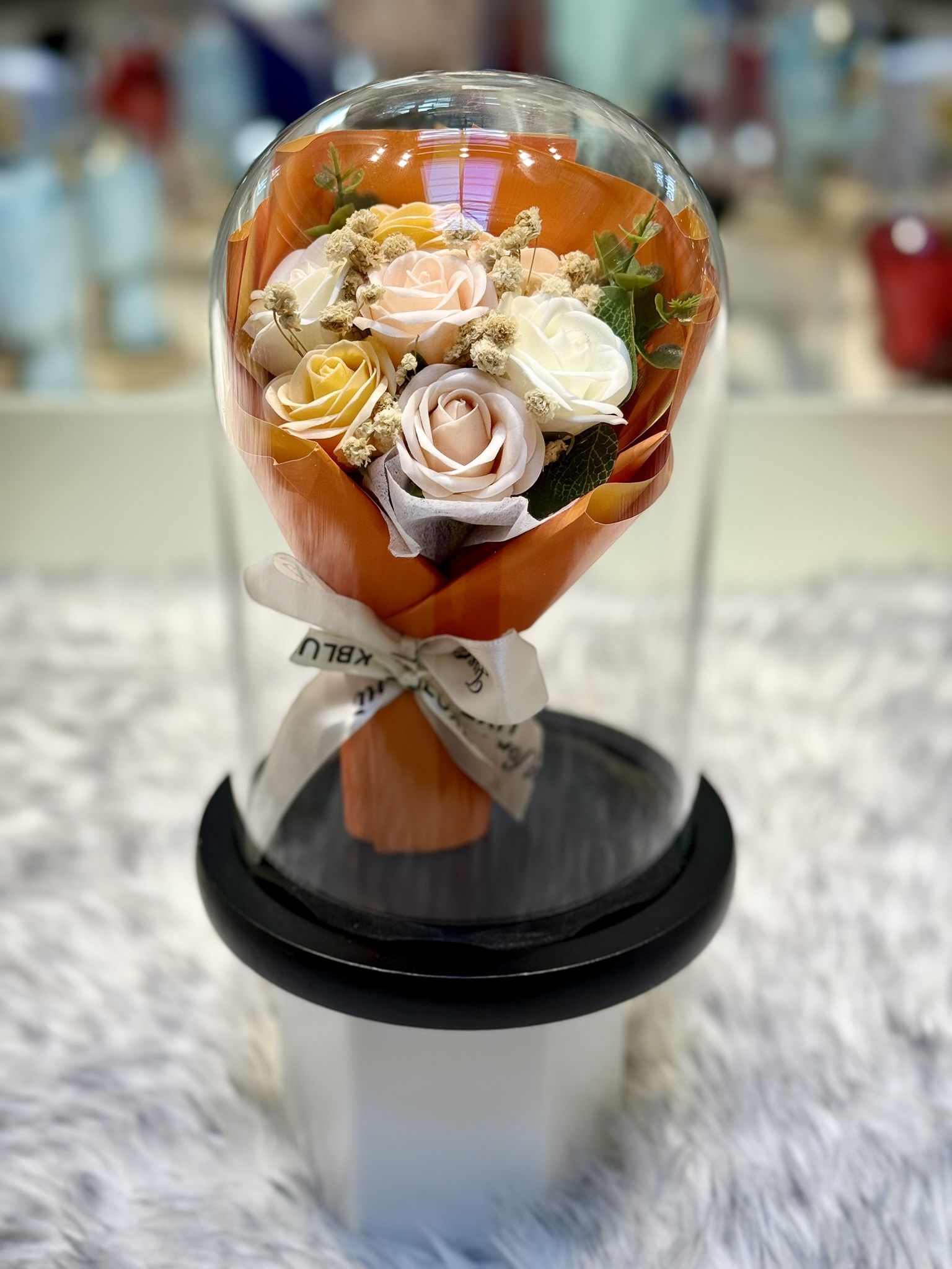 Orange-Pink Preserved Soap Flower Bouquet In Glass Bottle