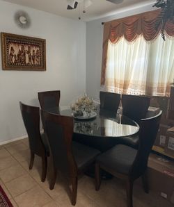 :  Dining Table Set – 6 Chairs Beautiful modern dining table with glass top and 6 sturdy chairs. Clean, well maintained, and in excellent condition. P