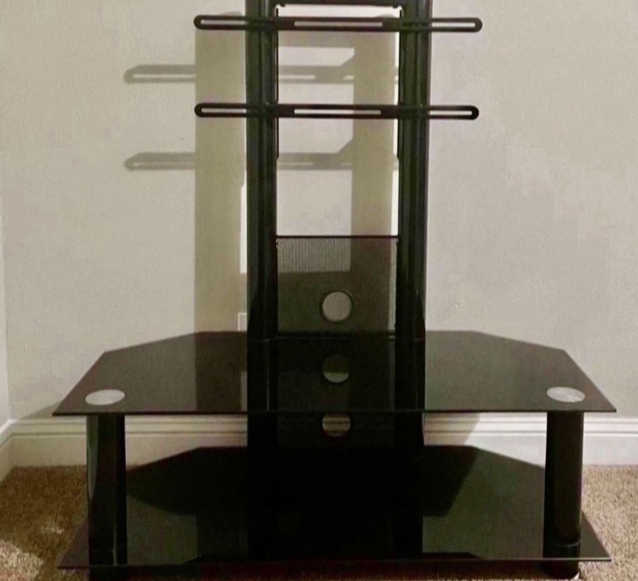 Sleek Black Glass TV stand with Multiple Shelves 💵 Elegante Soporte de TV de Vidrio Negro con Múltiples Estantes.