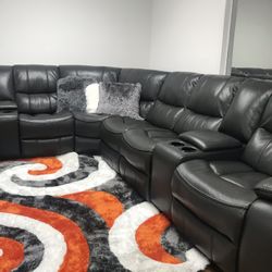HUGE GRAY LEATHER GEL SECTIONAL WITH 3 RECLINERS. 