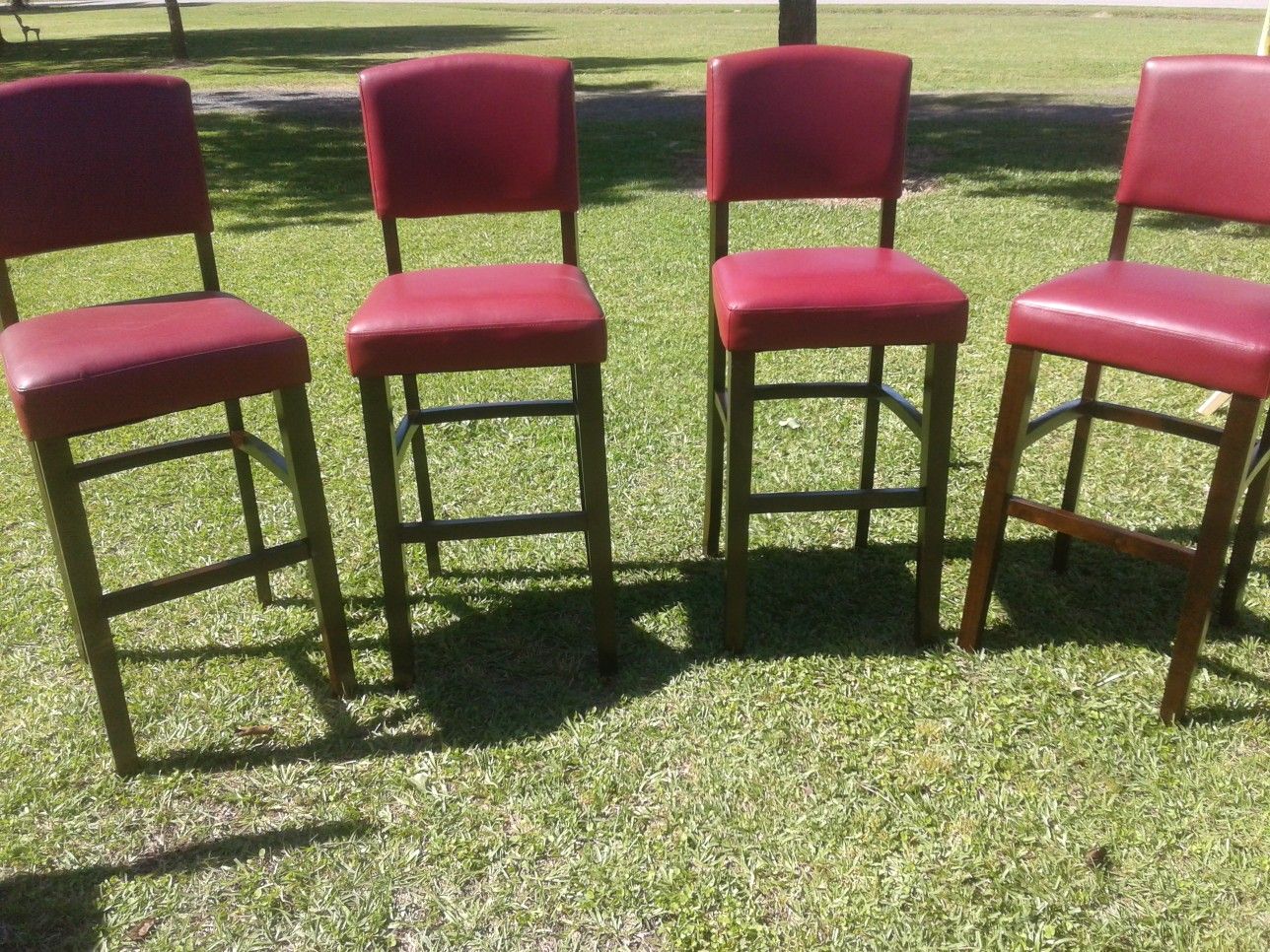 Four leather padded chairs
