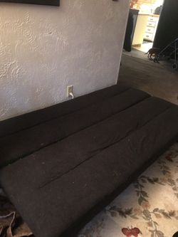 Black futon folds into couch. Nothings wrong with it just has cat hair for our kittens