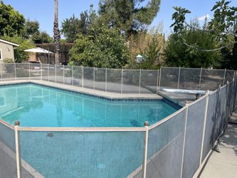 Pool fence with safety gate