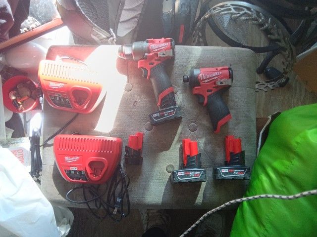 MILWAUKEE TOOlS, BATTERIES, And BATTERY CHARGERs. And TOOL BAG.