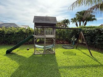 KidKraft Wooden Swing Set Playhouse with Slide, Hammock & dual Swings