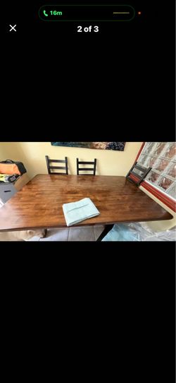 Kitchen farm table with 4 black chairs