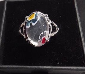Size 9 silver tone statement ring featuring a large oval clear glass cabochon