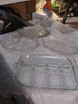 Crystal serving dishes, 4 small lunch plates, butter dish, and olive pickle plate.