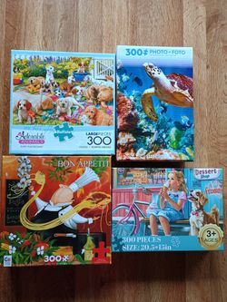 Four Quality  300 Piece Puzzles 