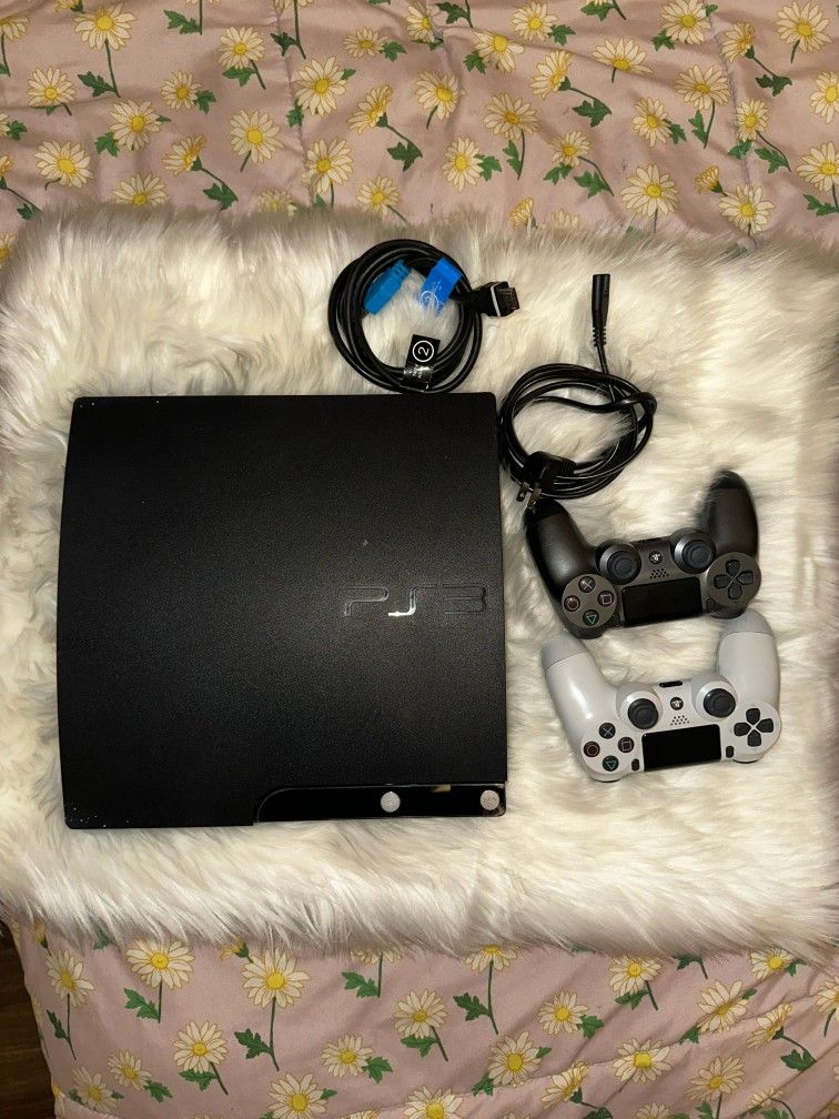 PS3 with two PS4 controllers; the white controller is already configured, the other controller is new.
