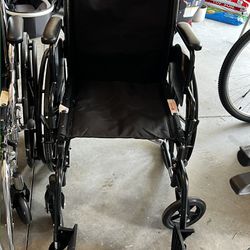 Collapsible Wheelchair With Footrests 