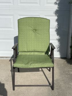 Two padded folding chairs