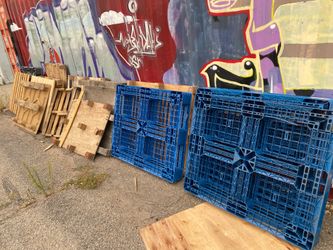 Blue Plastic Pallets and wood ones