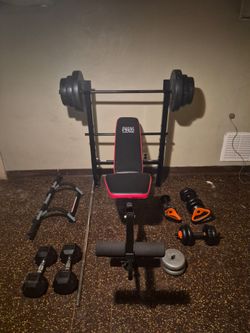 Weights and bench with dumbells and kettle bells plus door pull up bar.