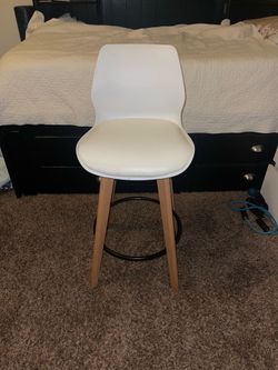 Modern white swivel bar stool