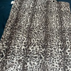  A small blanket with a cat pillow