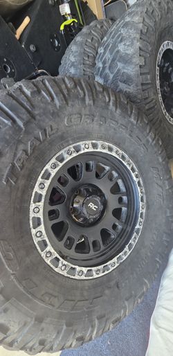 37x12.50R17 Nitto Trail Grapplers on 17" Rough Country Wheels - 5x5 Jeep