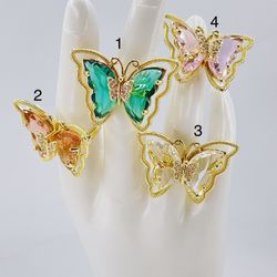 Gold plated Crystal Adjustable Butterfly Rings/Anillos de mariposa ajustables de cristal ORO LAMINAD- $12 EACH 