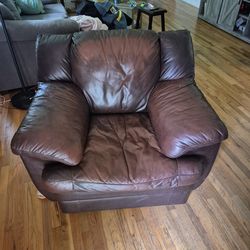 Overstuffed brown leather chair.