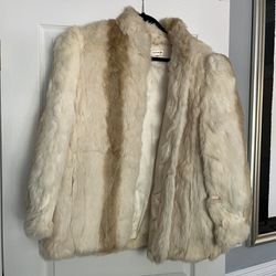 Vintage 1960s authentic rabbit fur coat in cream and tan.  Womans size large. Beautiful condition.