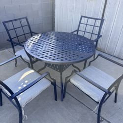 PATIO TABLE WITH 4 METAL CHAIRS