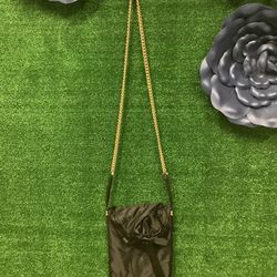 Henri Bendel Black And Gold Crossbody Purse With Gold Hardware And Ribbon Bow On Front 