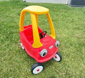 Selling a red and yellow Little Tikes ride-on car.