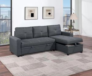 Brand tufted charcoal or light gray linen sectional with pullout sofa and storage chaise