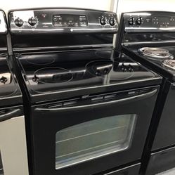 GE 4 Burner Glass Top Range. 1 year Warranty 