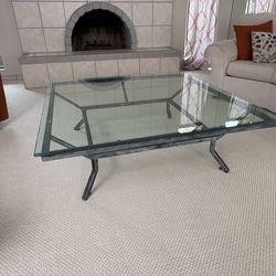 Glass top coffee table with metal base