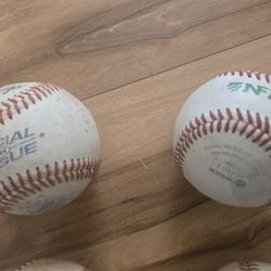 Two Baseball Gloves And Leather Baseballs