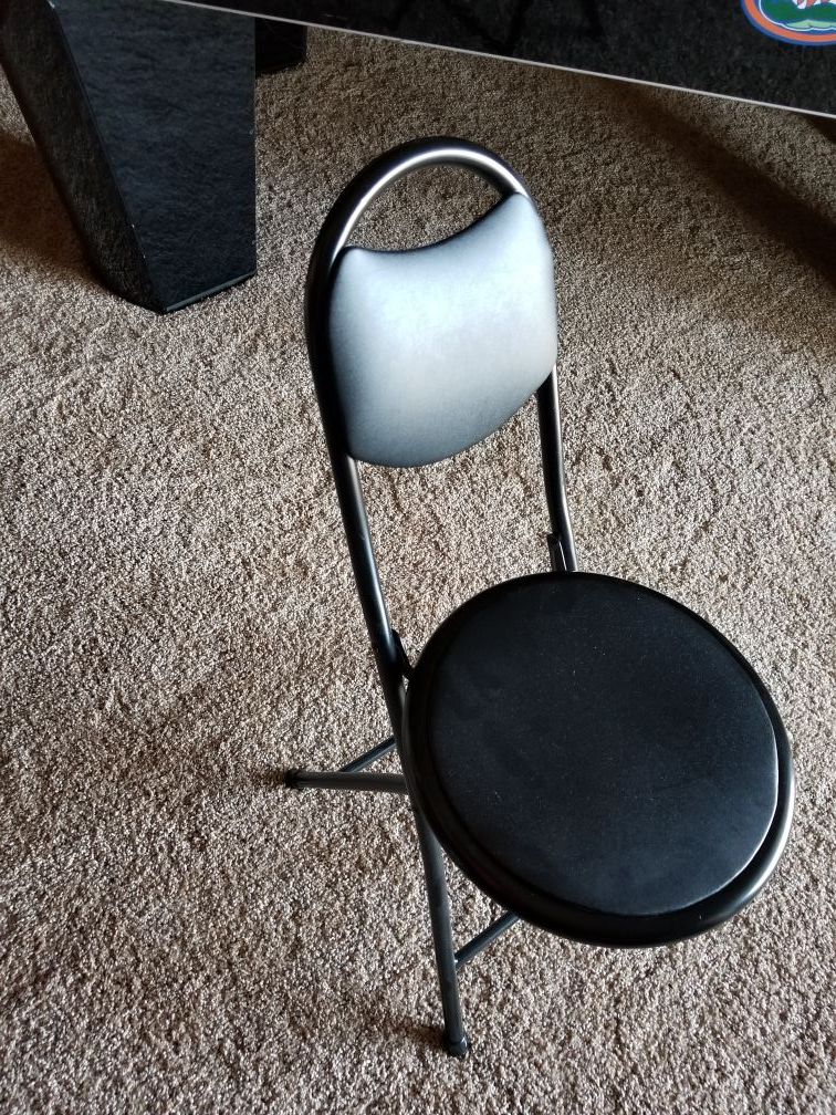 Black folding padded gaming chair
