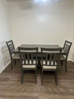 Table with 4 chairs and bench